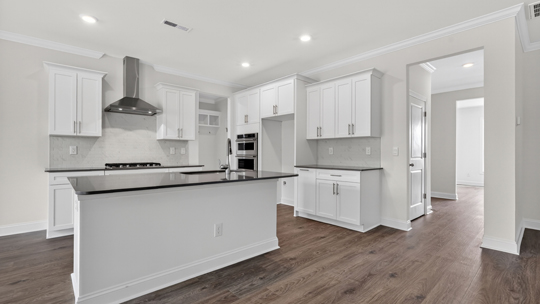 kitchen with island white cabinets and quartz countertops