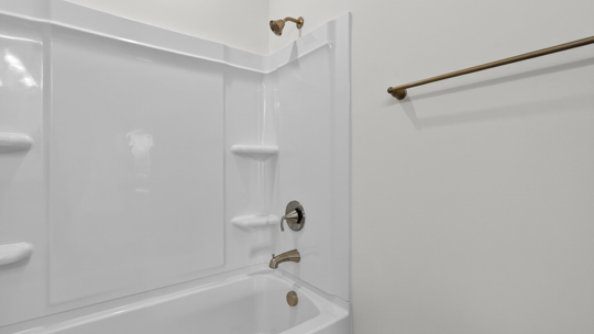 bathroom with tub shower combo