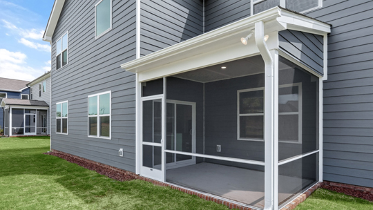 covered and screened in back patio