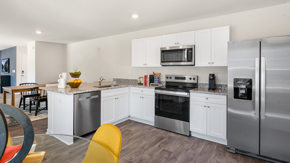 kitchen with white cabinets and granite countertops