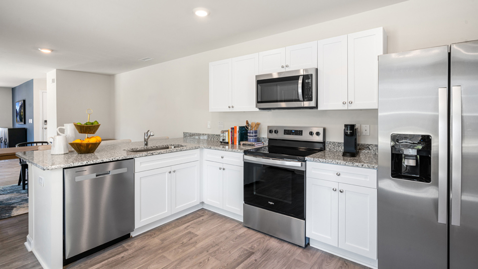 kitchen with white cabinets and granite countertops