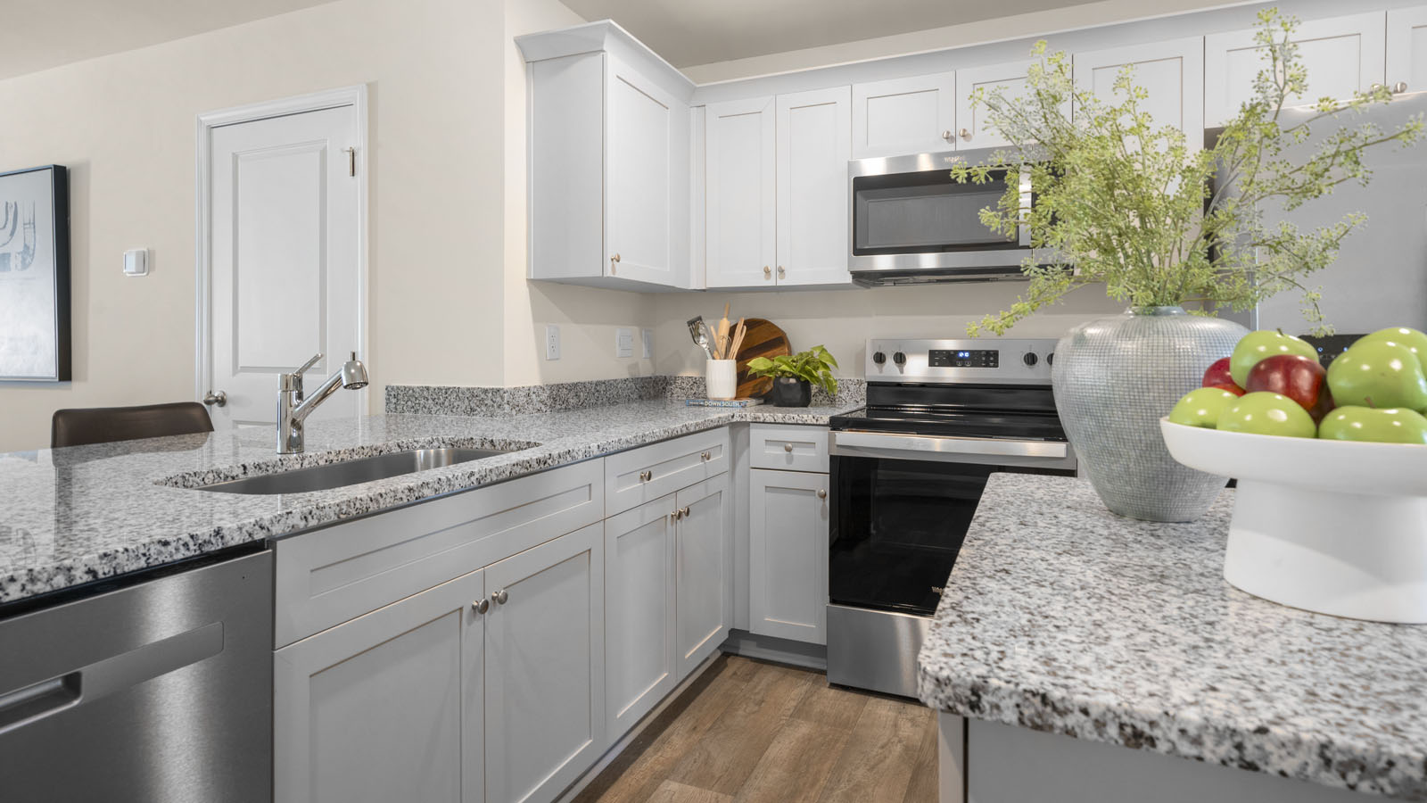 kitchen with white cabinets and granite countertops