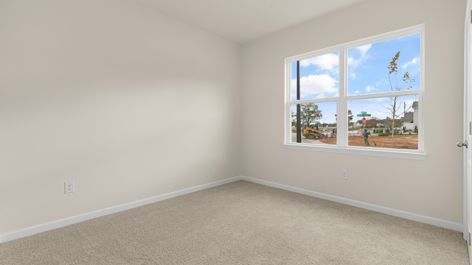 additional bedroom with window, carpeting, closet