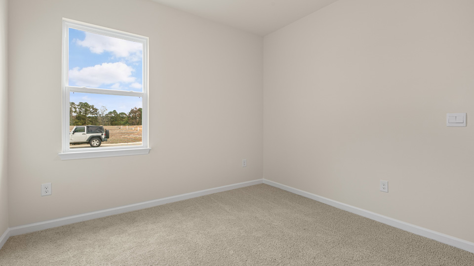 additional bedroom with window, carpeting, closet