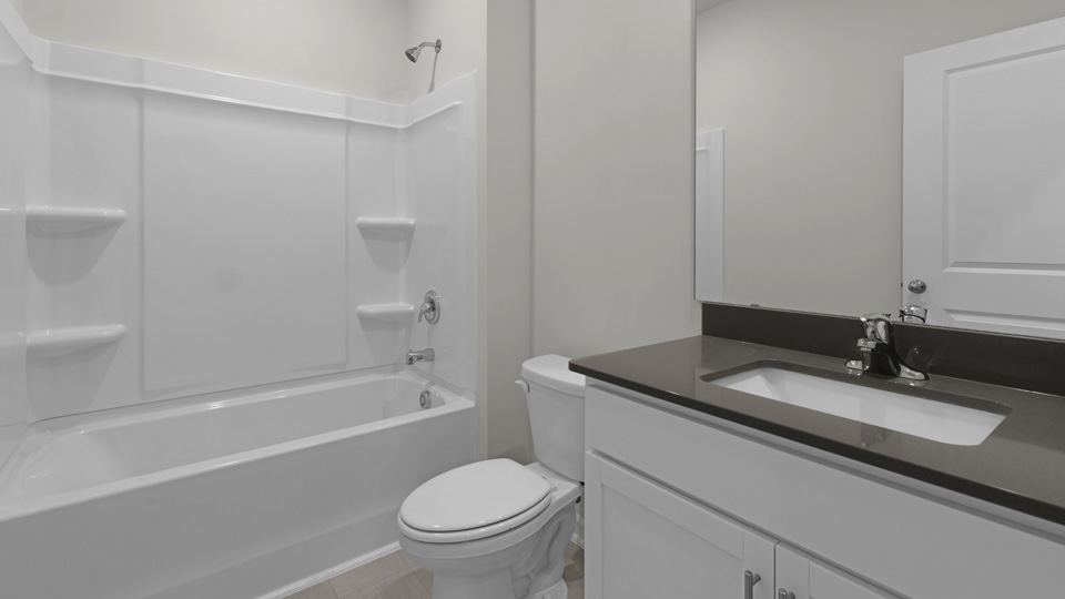 Bathroom with white cabinets