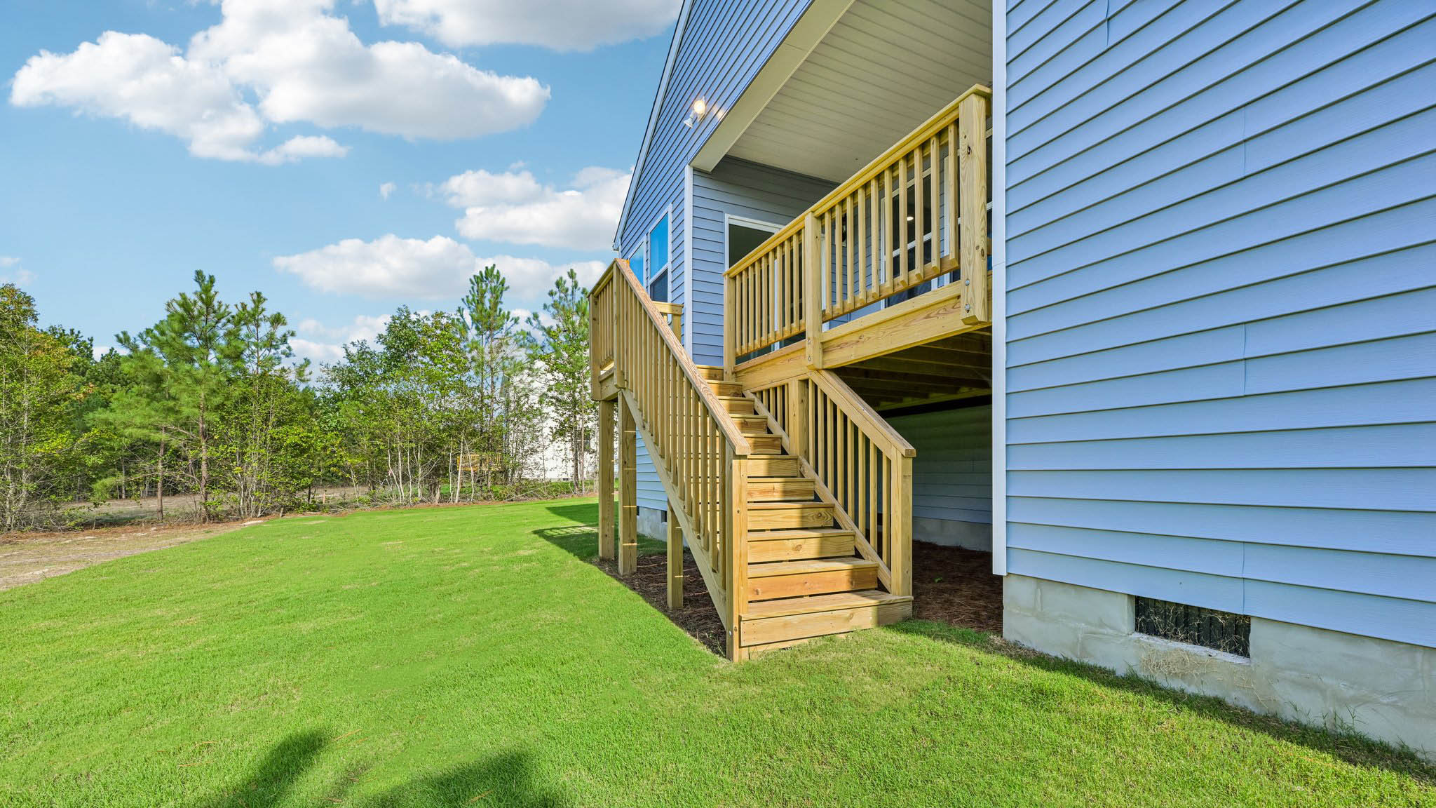 covered back deck leading down to backyard