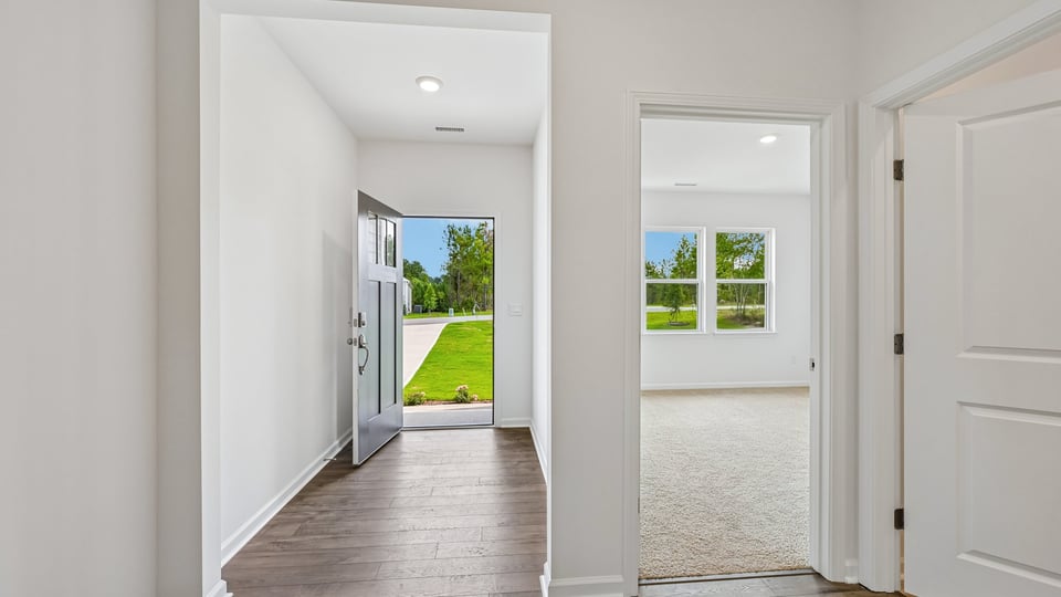 foyer entryway with guest bedroom on the right