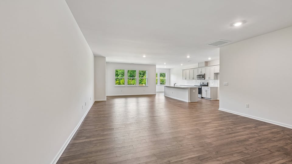 living room with revwood flooring