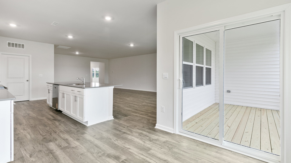 open concept dining space with sliding glass door to patio