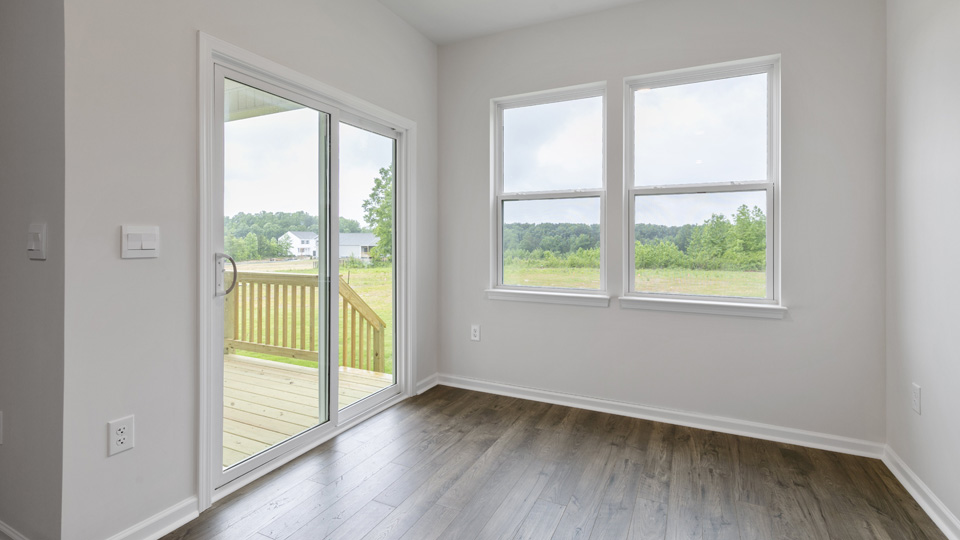 open concept dining space with sliding glass door to patio