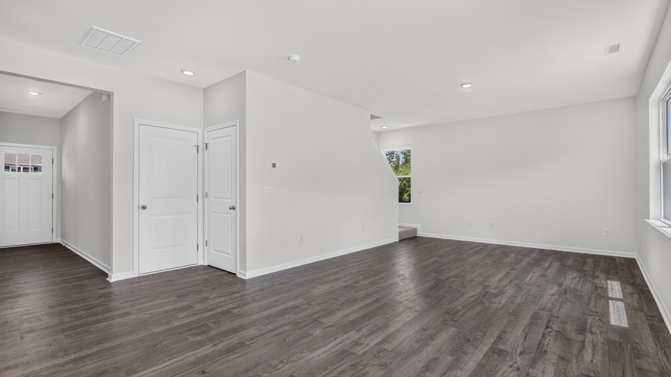 open concept living space with large windows