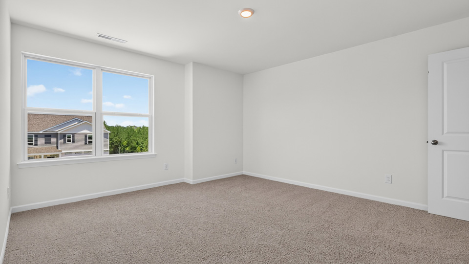 additional bedroom with window, carpeting, closet