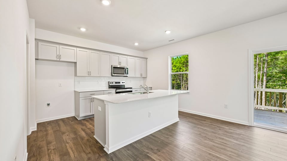 kitchen with center island white cabinets and quartz countertops