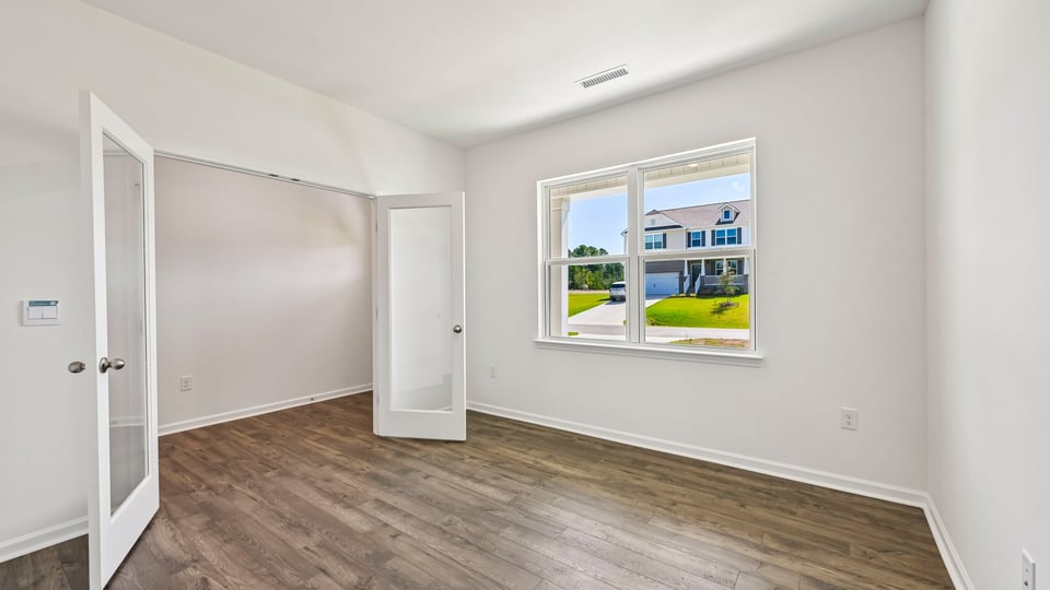 study with french doors and revwood flooring