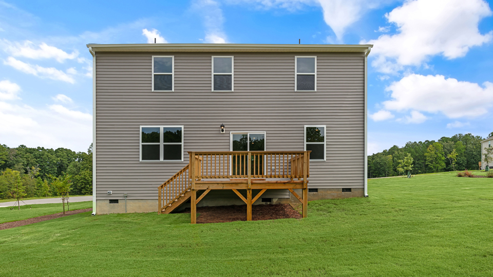 back exterior galen floor plan with deck and large yard