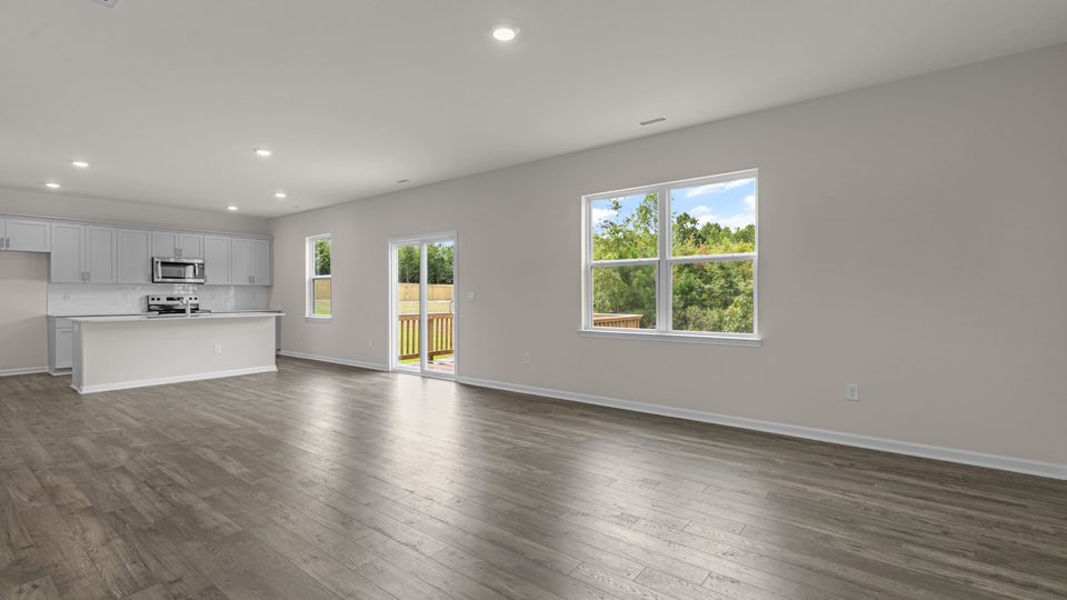 open concept living space with large windows