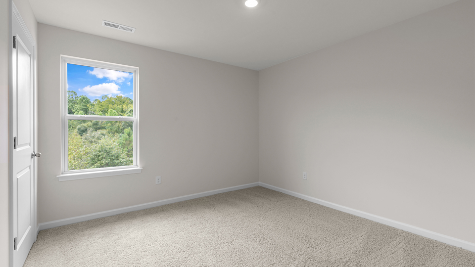 additional bedroom with window, carpeting, closet