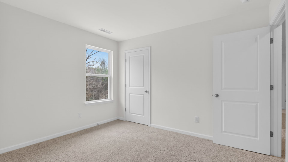 Bedroom with carpet floor and closet