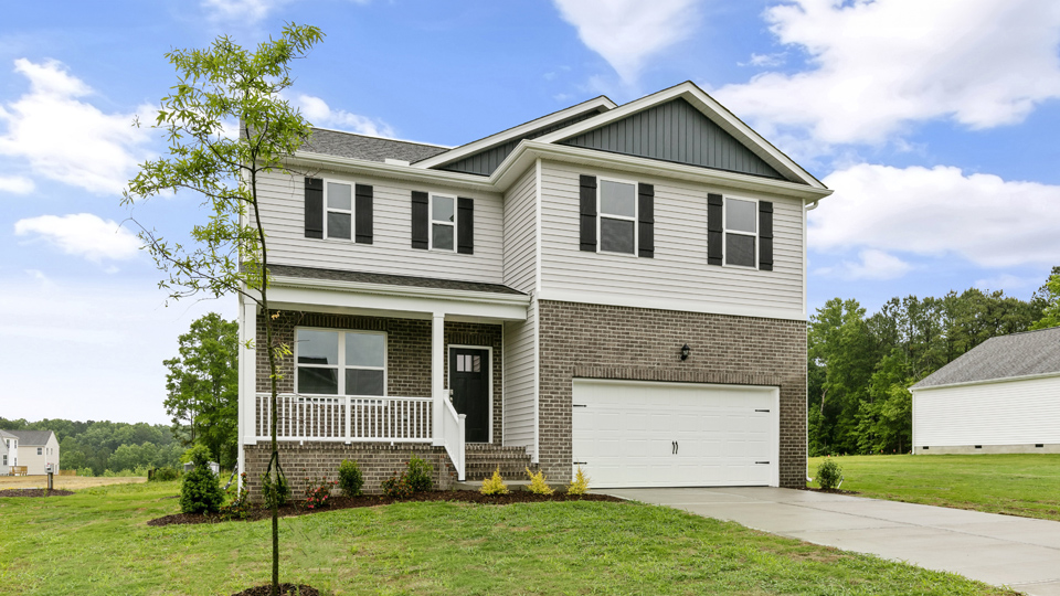 Covered front porch with two-car garage