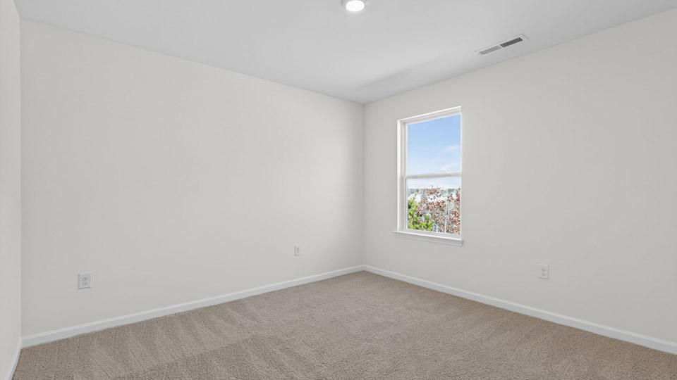 additional bedroom with window, carpeting, closet