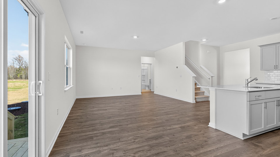 open concept dining space with door to patio