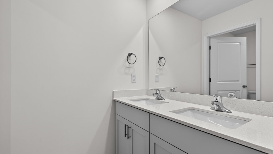 additional bathroom with double vanity sink