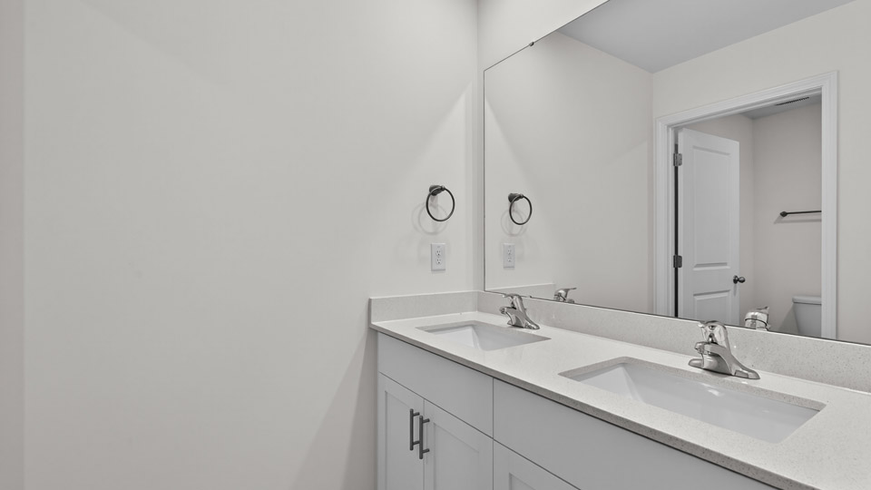 Bathroom with double sink and tub