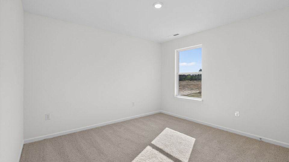 Bedroom with carpet floor and window