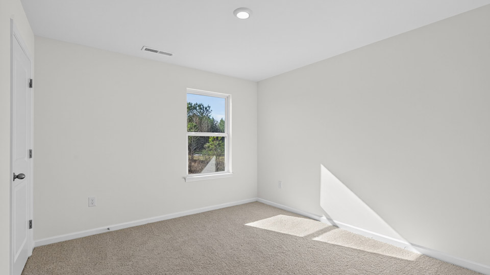 Bedroom with carpet floor and window