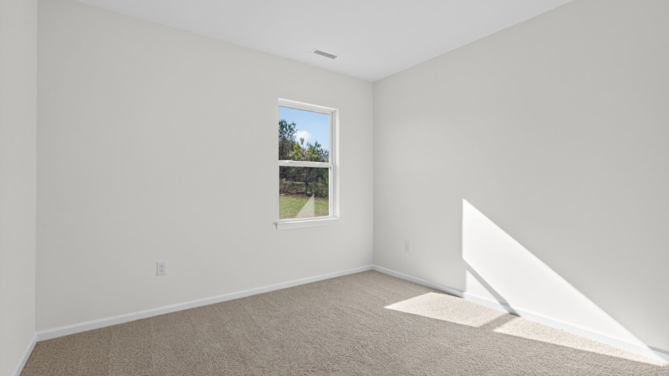 Bedroom with carpet floor and window