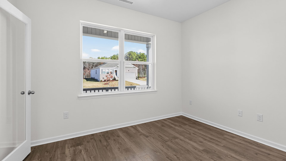 Study room with hardwood floors and big windows