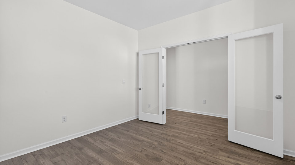 Study room with hardwood floors and big windows