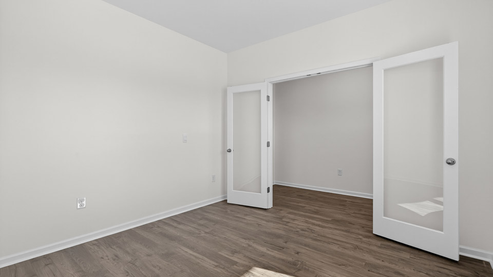 Study room with hardwood floors and big windows