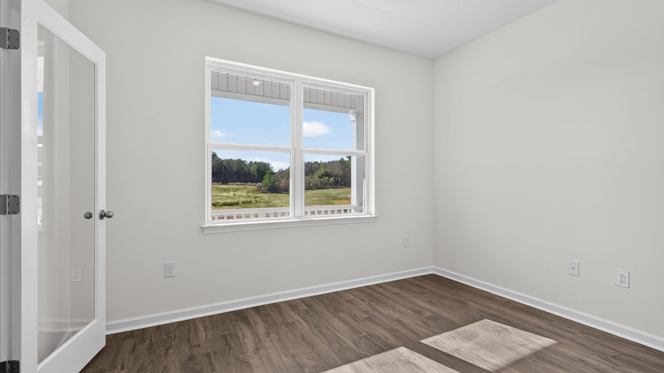 Study room with hardwood floors and big windows