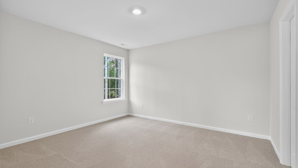 additional bedroom with window, carpeting, closet