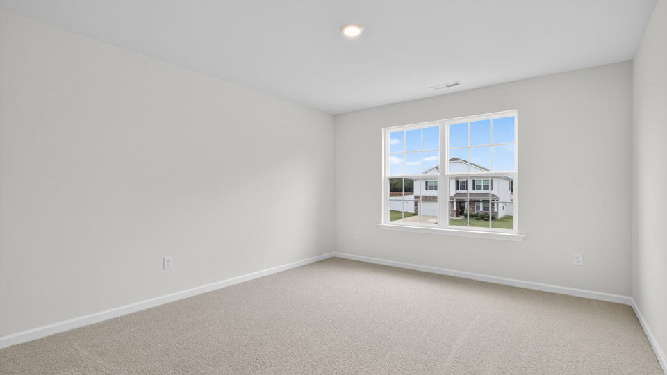 additional bedroom with window, carpeting, closet
