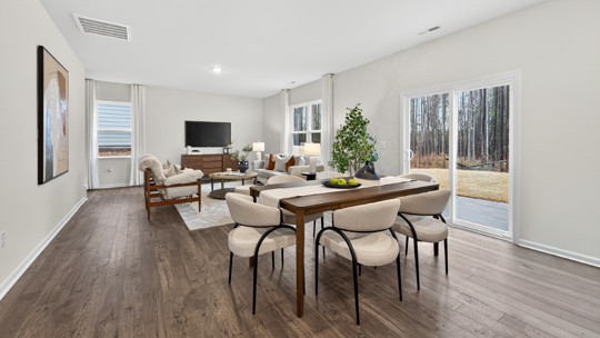 open concept dining area overlooking living room