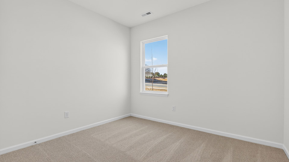 additional bedroom with window, carpeting, closet