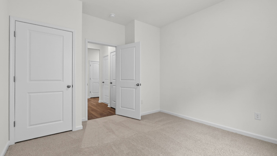 additional bedroom with window, carpeting, closet