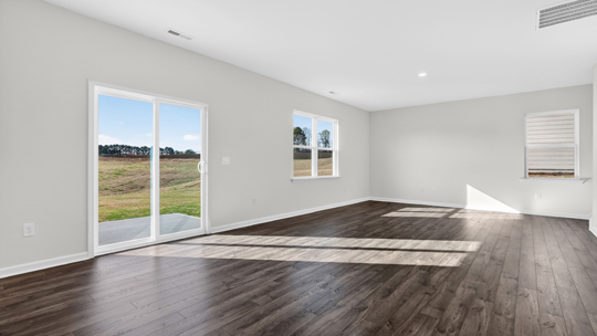 dining area and living room with sliding glass doors
