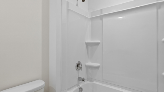 bathroom with tub shower combo