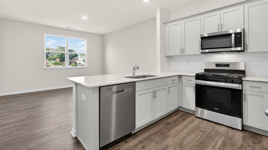 kitchen with white cabinets and quartz countertops