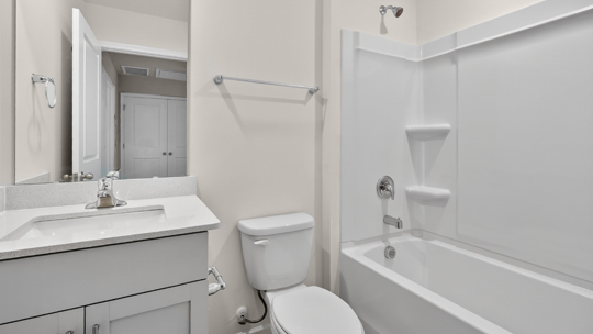 bathroom with tub shower combo