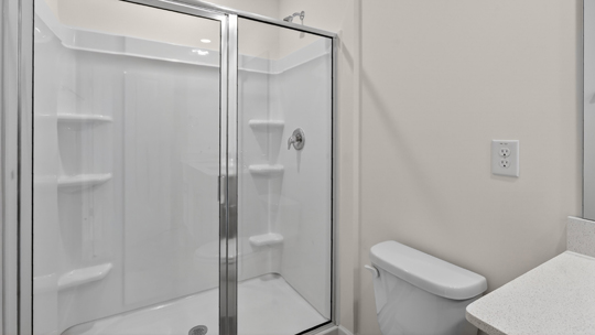 bathroom with walkin shower with glass doors