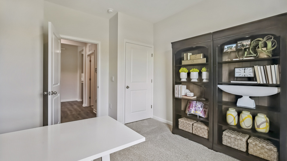 additional bedroom with window, carpeting, closet
