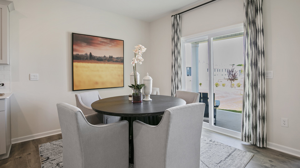 open concept dining space with sliding glass door to patio