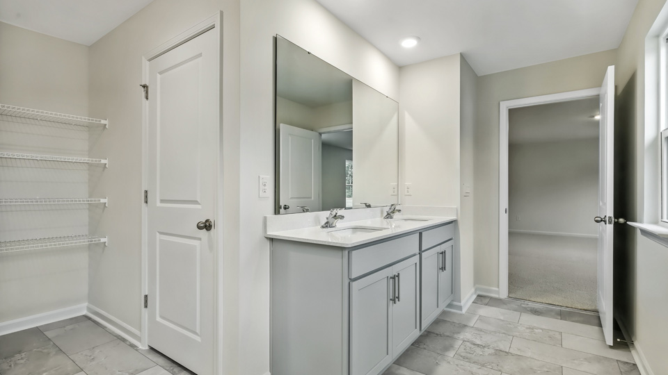 Bathroom with grey cabinets