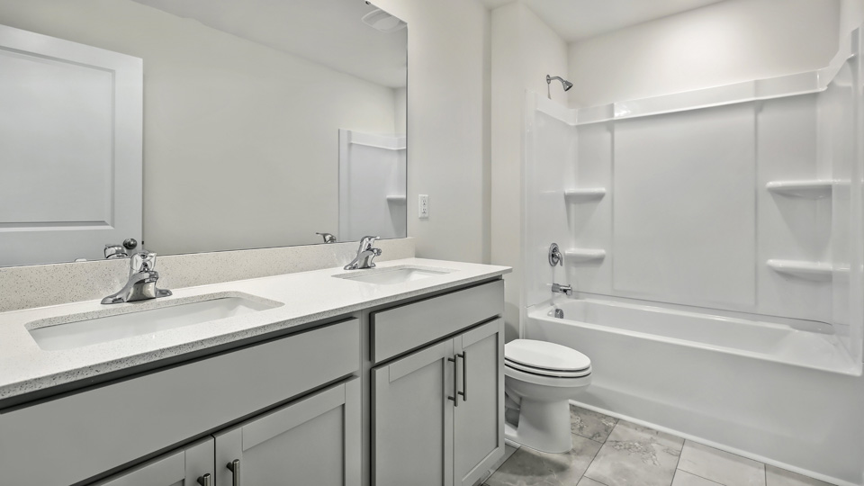 Bathroom with grey cabinets