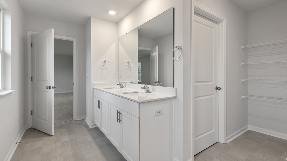 Bathroom with white cabinets