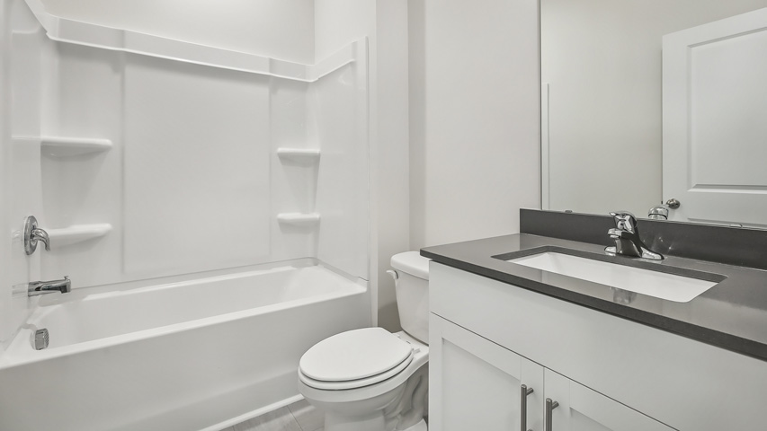 Bathroom with white cabinets